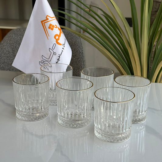 سێت پەرداخی شووشەی ڕوون و جوان بە ڕیمی زێڕین