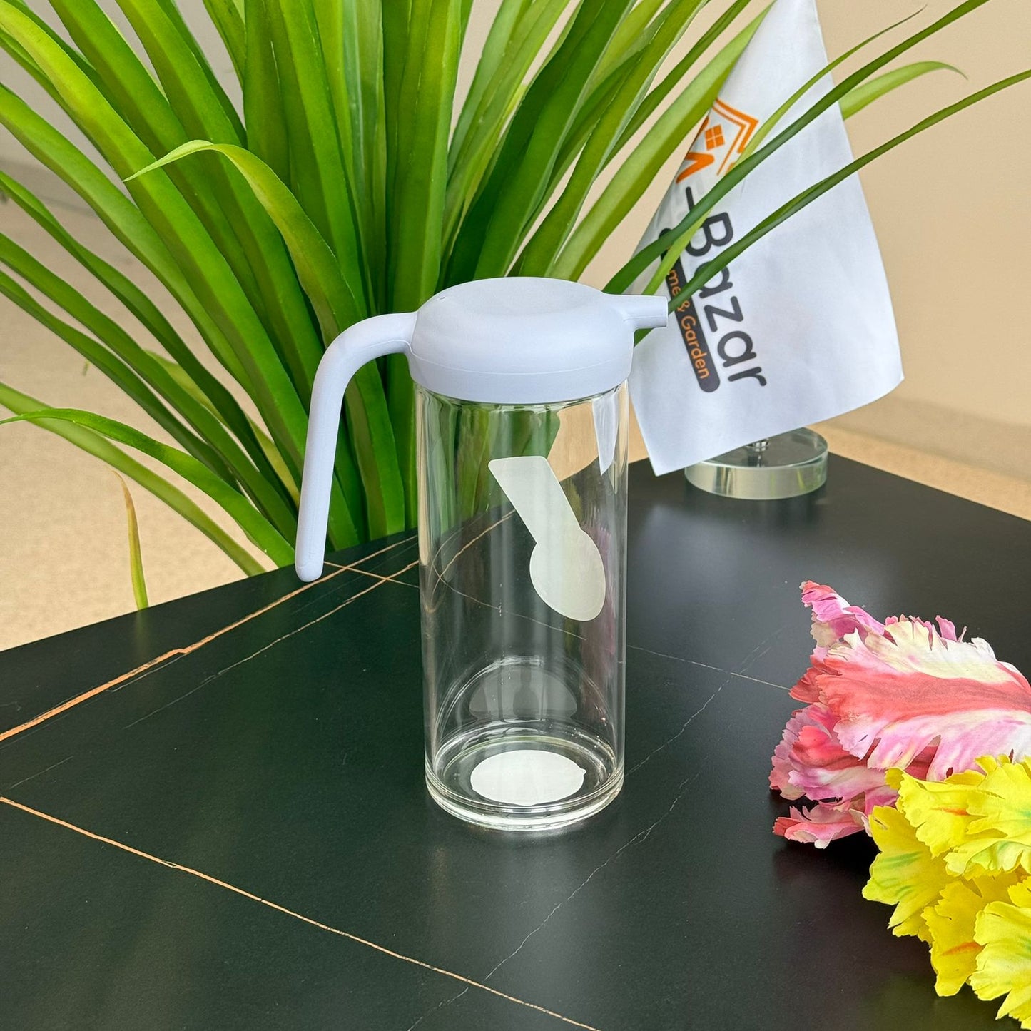 إبريق زجاجي صغير بغطاء سيليكون